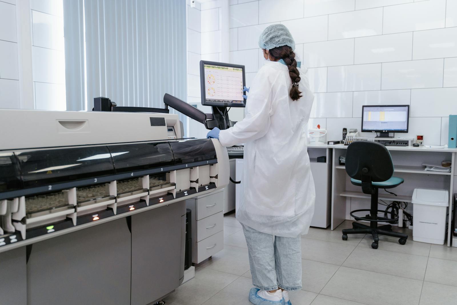 Engineers in a controlled cleanroom environment